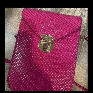 Small pink purse with latch, faux leather texture/feel, small crossbody purse